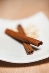 Bowl of cinnamon on a plate on the table