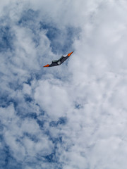 Naklejka na ściany i meble cerf-volant dans un ciel bleu avec nuage, Îles de la madelaine, Québec, Canada