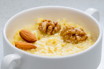 corn porridge with nuts in a ceramic plate