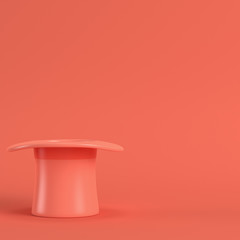 Top hat in living coral color. Minimalism concept