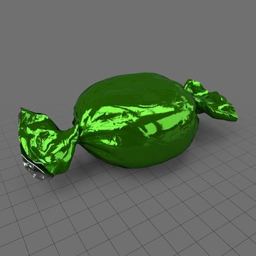 Hard candy in green wrapper
