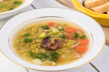 Homemade pea soup with smoked bacon.