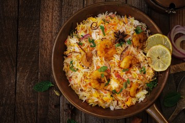 Shrimp (Prawn ) Biryani top down view on wooden background