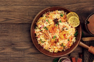 Shrimp (Prawn ) Biryani top down view on wooden background
