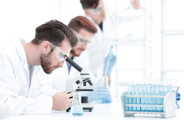 background image scientists working with the microscope