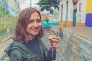 tourist girl drinking typical drink from south and central america called 
