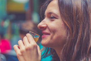 tourist girl drinking typical drink from south and central america called 