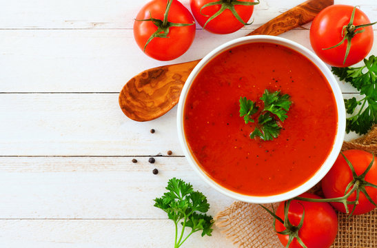 Homemade Tomato Soup. Above View, Side Border With Copy Space On A White Wood Background.