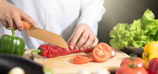 Chef prepares fresh vegetables. Healthy nutrition