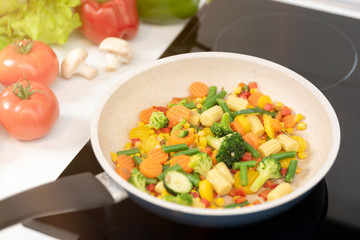 Fresh vegetables fried in a pan. Healthy nutrition concept