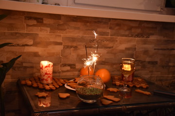 Fototapeta na wymiar Winter evening with candles and ginger cookies