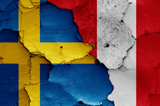 flags of Sweden and Peru painted on cracked wall
