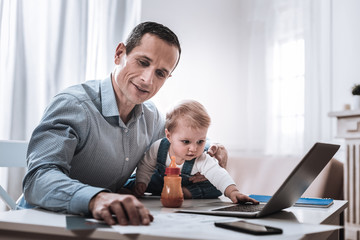 Positive smart man doing his work