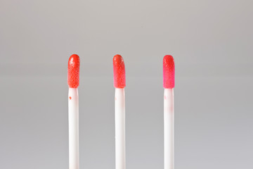 Brush of liquid lipstick. Lipgloss stick.