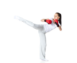 Young woman in fighting gloves