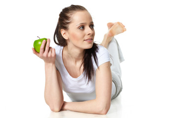 Young beautiful woman with an apple.