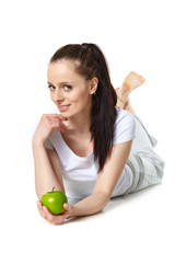 Young beautiful woman with an apple.