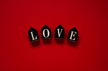Red background with text LOVE. Valentines day concept. Valentines day card concept. 