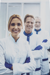 Cheerful scientists looking straight at camera