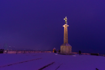 View of Kalemegdan Park in Belgrade the capital of Serbia in Europe during snow in winter in the evening