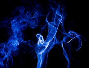 Fototapeta premium Blue smoke on black background
