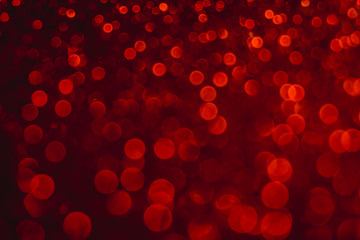 Valentine's day red lights defocused background. Red bokeh concept.