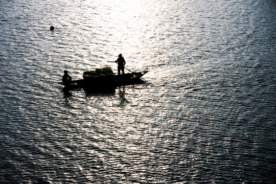  Vietnam, Hoi An, boating across suburban river.