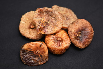 Dried figs isolated on a black  background