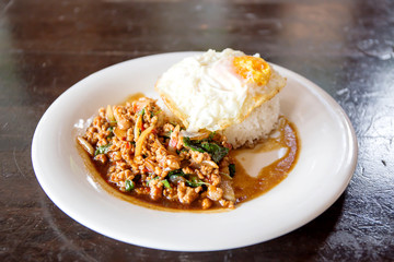 Rice topped with stir-fried minced pork and basil with Fried egg