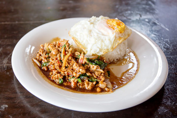 Rice topped with stir-fried minced pork and basil with Fried egg