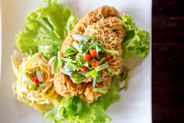 Crispy Catfish Salad Served white plate
