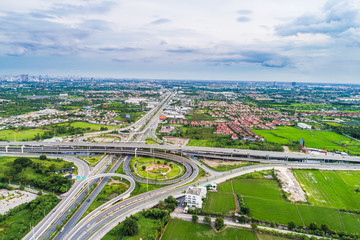 Naklejka premium Transport junction traffic green city road aerial view