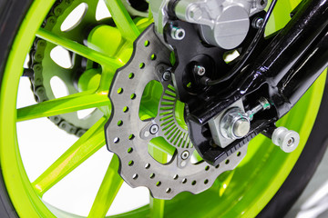 Obraz premium Detail Motorcycle wheel in black and green with ABS brakes part of the motorcycle.
