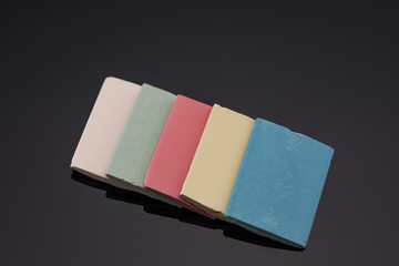 Tailor chalk. Colorful chalk on black