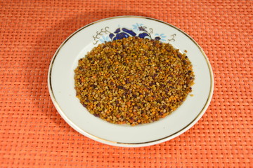 Bio organic bee pollen in a porcelain plate