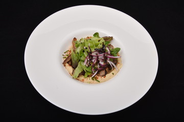  duck meat in sauce with organic salad