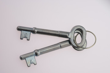 An Old-Fashioned Key on a White Background