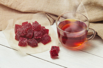 Homemade cranberry marmalade on a light background