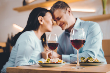 Dreaming couple drinking wine in a restaurant
