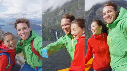 Happy couple taking selfie video on travel vacation New Zealand, Milford Sound in Fiordland National Park and Roys Peak New Zealand. Vertical video with Multicultural couple smilng having fun laughing - Powered by Adobe