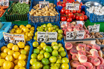 Limes, lemons and peaches for sale at a market in Brixton, London