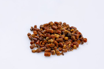 A bunch of propolis on a white background. Bee product. Close-up.