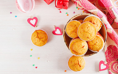 Muffins with pumpkin. Cupcakes with Valentine's Day decor. Flat lay. Top view.