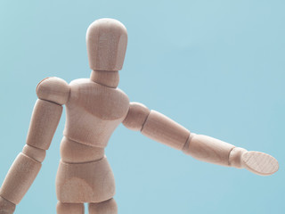 hand of man with blank sign on blue background