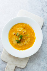 Pumpkin soup on marble background
