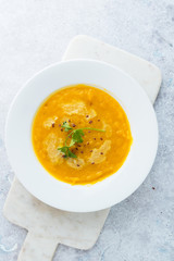 Pumpkin soup on marble background