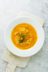 Pumpkin soup on marble background