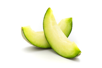 Green melon slices isolated on white background.