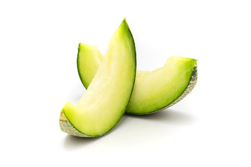 Green melon slices isolated on white background.