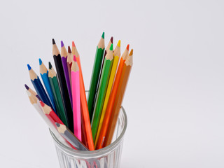colored pencils sharpened on a white background.